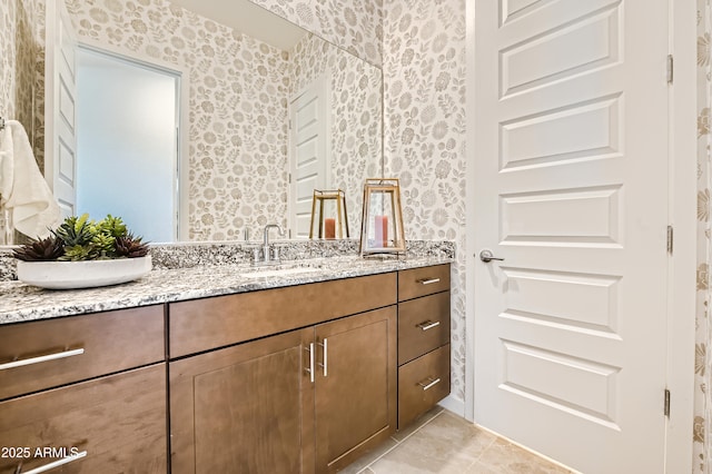 bathroom featuring wallpapered walls, vanity, and tile patterned floors