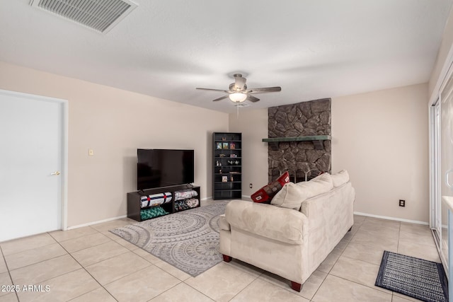 15424 N 52nd Pl, Scottsdale, AZ 85254 - living room with ceiling fan, light tile patterned floors, baseboards, and a fireplace