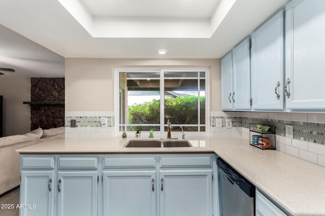 15424 N 52nd Pl, Scottsdale, AZ 85254 - kitchen with dishwasher, a sink, decorative backsplash, open floor plan, and light countertops