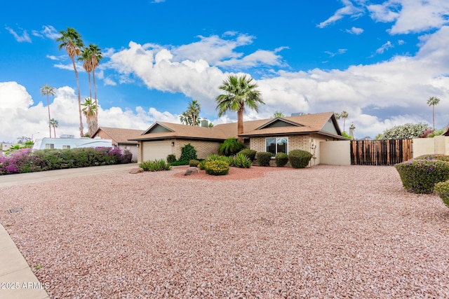 15424 N 52nd Pl, Scottsdale, AZ 85254 - ranch-style house featuring driveway, fence, a garage, and brick siding