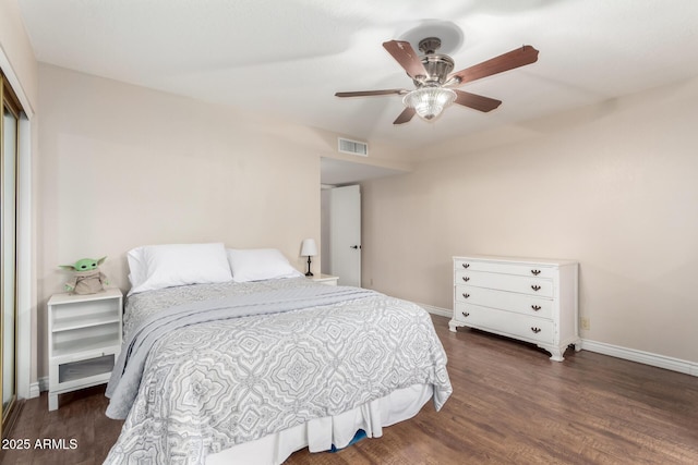 15424 N 52nd Pl, Scottsdale, AZ 85254 - bedroom featuring wood finished floors, baseboards, a closet, and ceiling fan