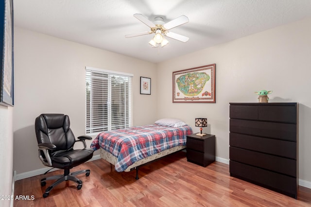 15424 N 52nd Pl, Scottsdale, AZ 85254 - bedroom featuring light wood finished floors, baseboards, and a ceiling fan