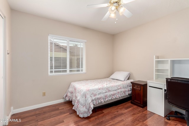 15424 N 52nd Pl, Scottsdale, AZ 85254 - bedroom with wood finished floors, baseboards, an office area, and ceiling fan