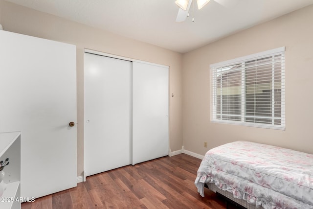 15424 N 52nd Pl, Scottsdale, AZ 85254 - bedroom featuring wood finished floors, baseboards, a closet, and a ceiling fan