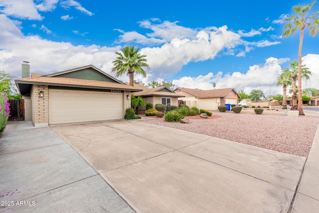 15424 N 52nd Pl, Scottsdale, AZ 85254 - ranch-style home with driveway, a garage, a chimney, and fence