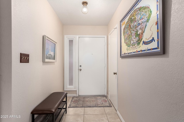 15424 N 52nd Pl, Scottsdale, AZ 85254 - doorway featuring baseboards, light tile patterned floors, and a textured wall