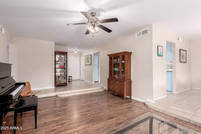 15424 N 52nd Pl, Scottsdale, AZ 85254 - living room featuring a ceiling fan, wood finished floors, and baseboards