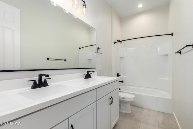 full bathroom featuring tile patterned floors, vanity, toilet, and shower / tub combination