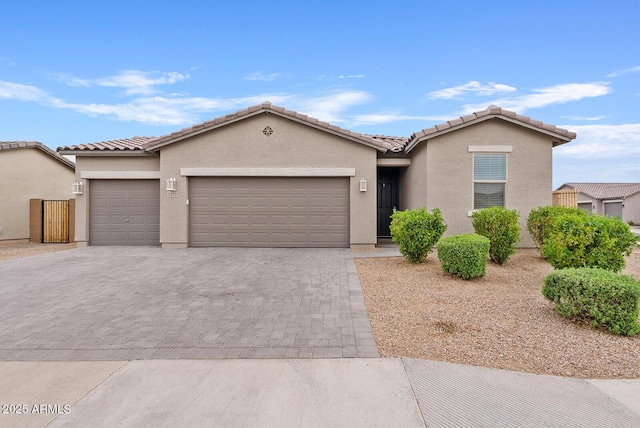 1272 E Jahns Dr, Casa Grande, AZ 85122 - single story home featuring stucco siding, decorative driveway, a tiled roof, and a garage