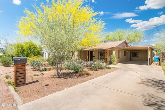 view of front of property with a carport