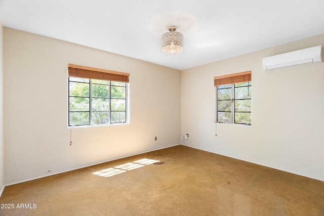 spare room with carpet floors, a healthy amount of sunlight, and an AC wall unit