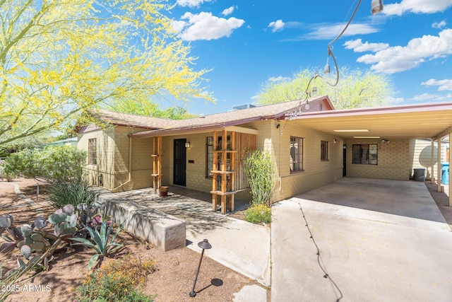 view of front of home with a carport