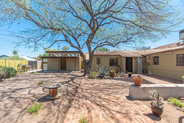 rear view of house with a patio