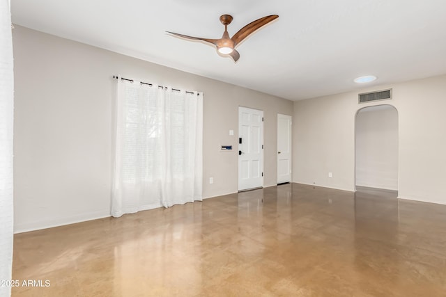 empty room featuring ceiling fan and concrete flooring