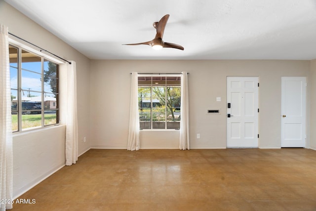 unfurnished room featuring ceiling fan