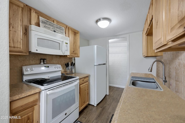 kitchen with tasteful backsplash, dark hardwood / wood-style floors, sink, white appliances, and light brown cabinets