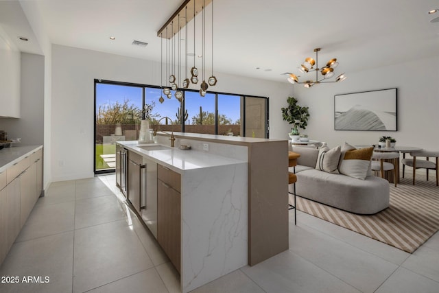 24863 N 103rd Way, Scottsdale, AZ 85255 - kitchen with a chandelier, modern cabinets, a sink, hanging light fixtures, and recessed lighting