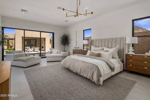 24863 N 103rd Way, Scottsdale, AZ 85255 - bedroom with a chandelier, light tile patterned flooring, and access to exterior