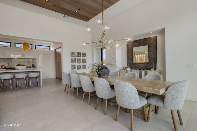 24863 N 103rd Way, Scottsdale, AZ 85255 - dining room with a chandelier, a towering ceiling, baseboards, and healthy amount of natural light