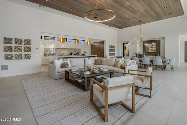 24863 N 103rd Way, Scottsdale, AZ 85255 - living area featuring wood ceiling, light tile patterned flooring, a chandelier, and a high ceiling