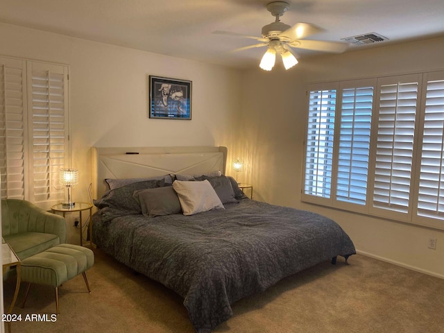 carpeted bedroom featuring ceiling fan