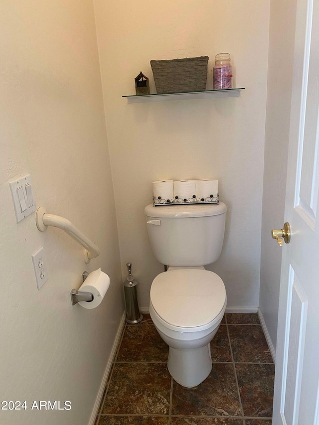 bathroom featuring toilet