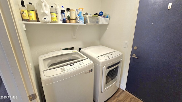 3002 W Caravaggio Ln, Phoenix, AZ 85086 - laundry room featuring independent washer and dryer and wood finished floors