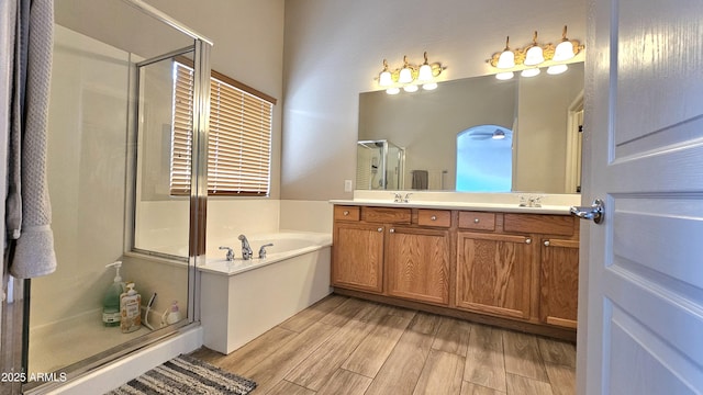 3002 W Caravaggio Ln, Phoenix, AZ 85086 - full bathroom with a stall shower, wood finished floors, a bath, and double vanity