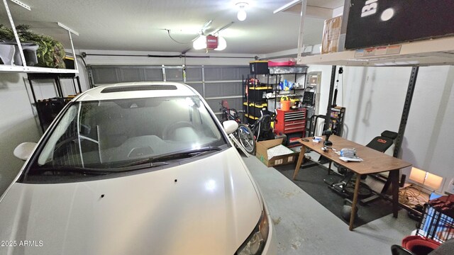 3002 W Caravaggio Ln, Phoenix, AZ 85086 - garage featuring a garage door opener and a workshop area