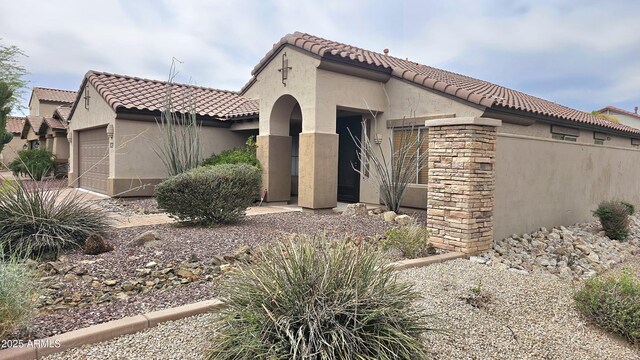 3002 W Caravaggio Ln, Phoenix, AZ 85086 - view of front facade with stucco siding, a garage, and a tiled roof