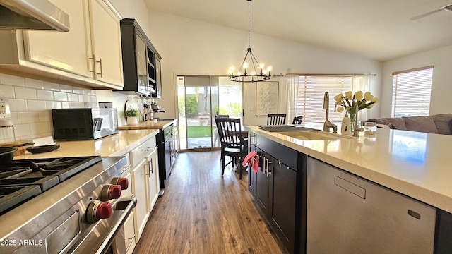 3002 W Caravaggio Ln, Phoenix, AZ 85086 - kitchen featuring ventilation hood, a sink, lofted ceiling, light countertops, and a chandelier