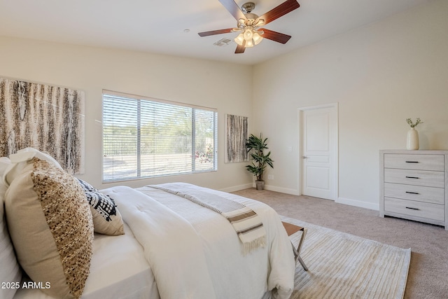 carpeted bedroom featuring ceiling fan and vaulted ceiling