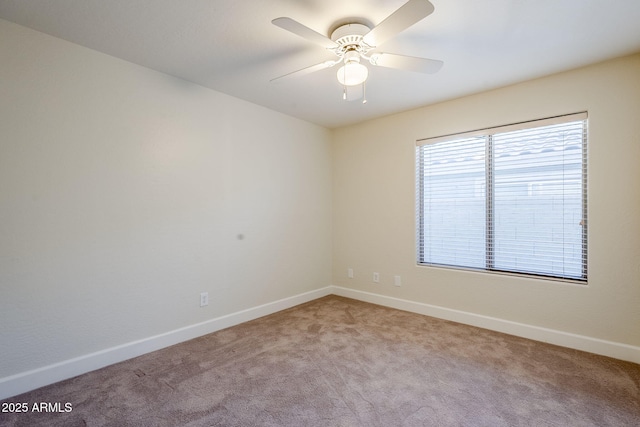 carpeted empty room with ceiling fan