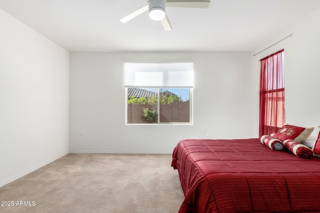 bedroom featuring ceiling fan and carpet