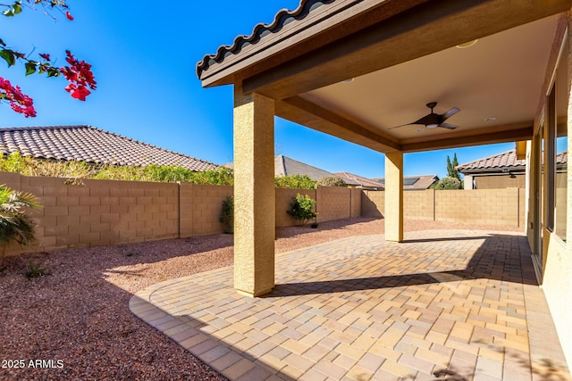 view of patio featuring ceiling fan