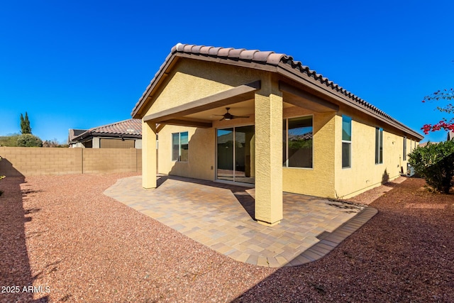 back of house featuring a patio and ceiling fan