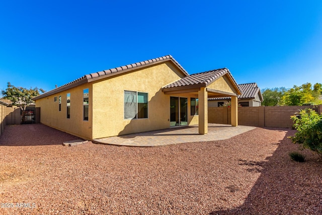 back of property with a patio area