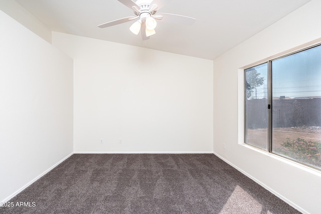 spare room featuring ceiling fan, baseboards, and carpet