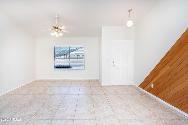 entrance foyer with light tile patterned flooring, a ceiling fan, and baseboards