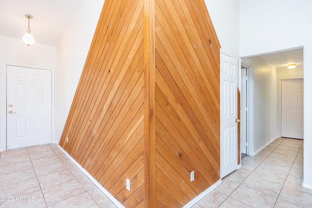 hall with light tile patterned flooring