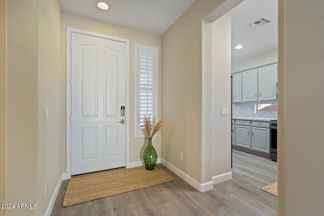 entrance foyer with light hardwood / wood-style flooring