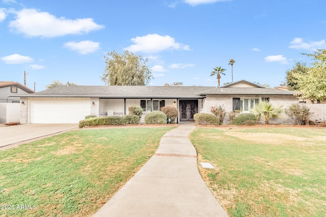 ranch-style home with a front yard and a garage