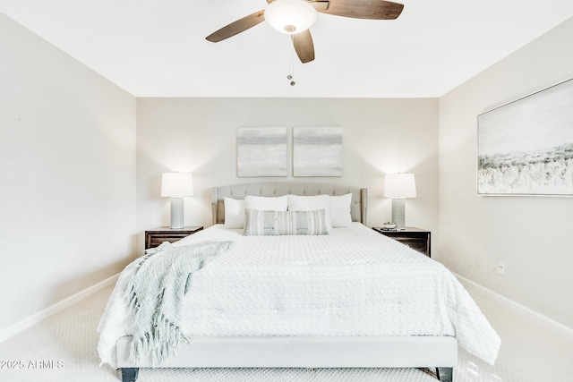 bedroom featuring light colored carpet and ceiling fan