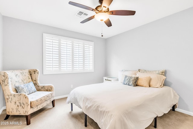 bedroom featuring ceiling fan and carpet