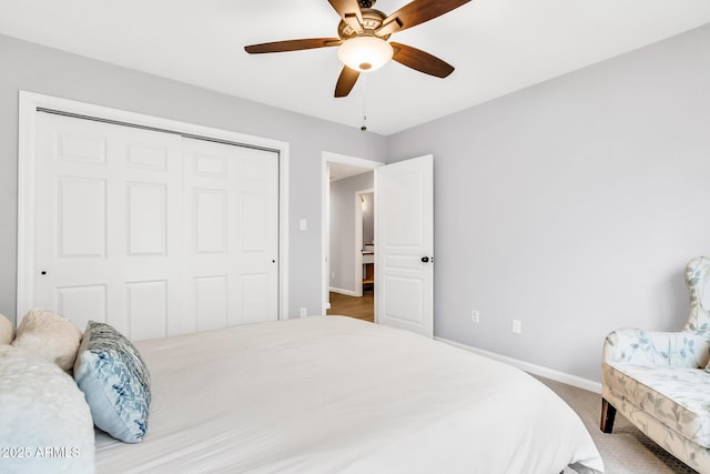 bedroom with ceiling fan and a closet