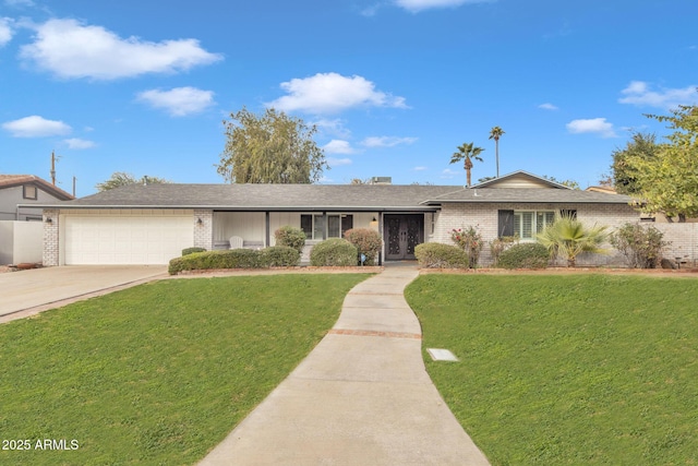 single story home with a front yard and a garage