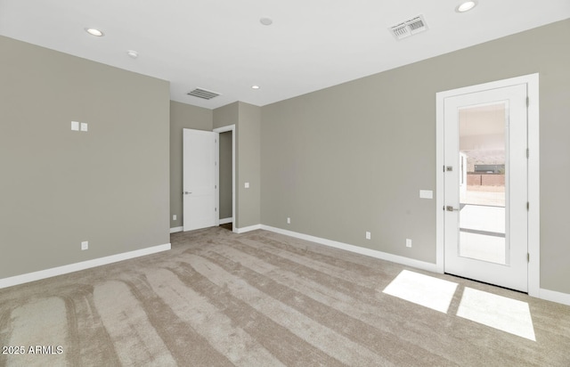 spare room with visible vents, recessed lighting, and baseboards