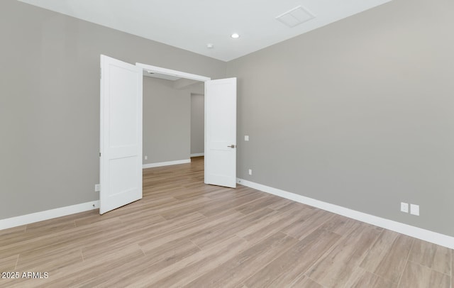 unfurnished bedroom featuring light wood-style flooring, recessed lighting, and baseboards