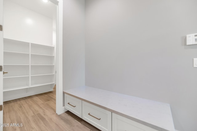 mudroom with light wood-style floors