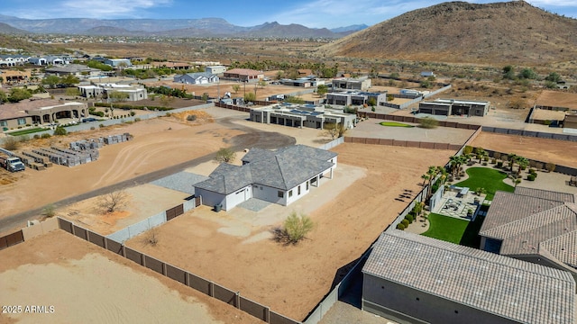 birds eye view of property featuring a mountain view and a residential view